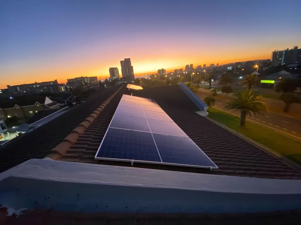 Solar panels at sunset on a home in Bloubergstrand, Cape Town